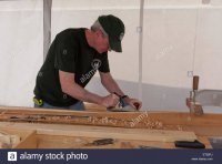 man-using-a-hand-planer-on-wood-usa-ET25FJ.jpg
