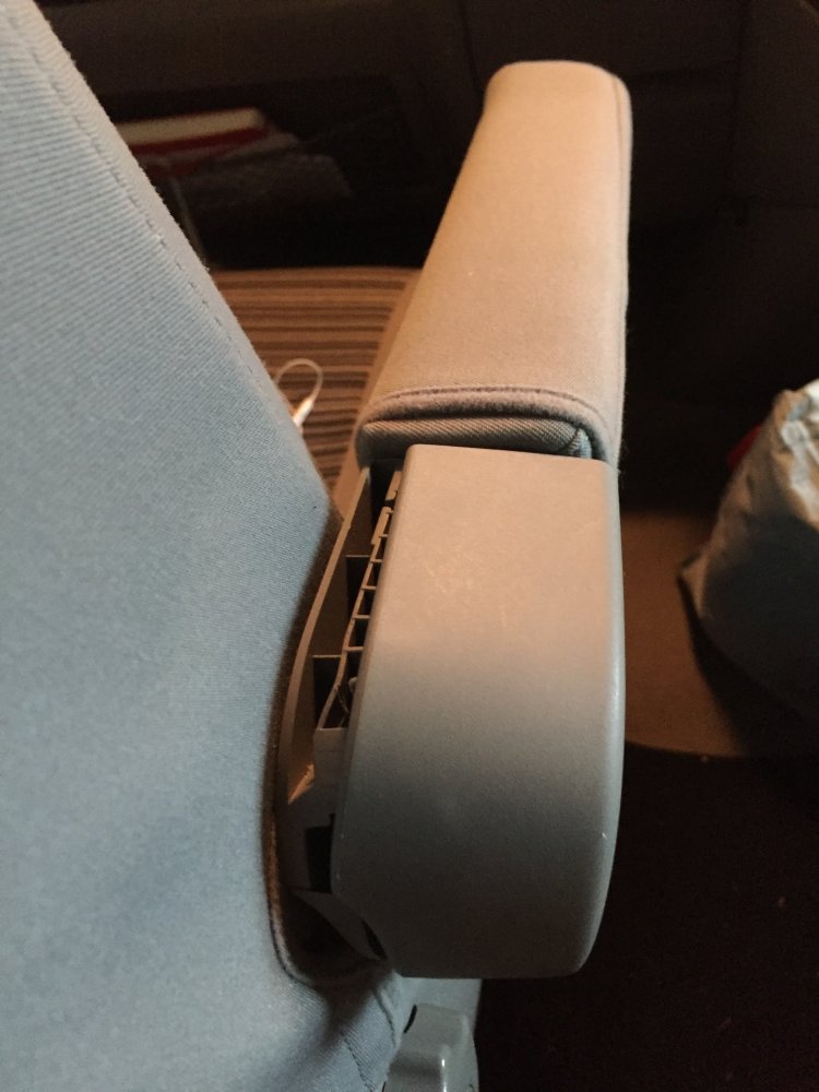 Passenger seat, right armrest.